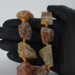 Pieza de piedra perforada en bruto de Cornalina